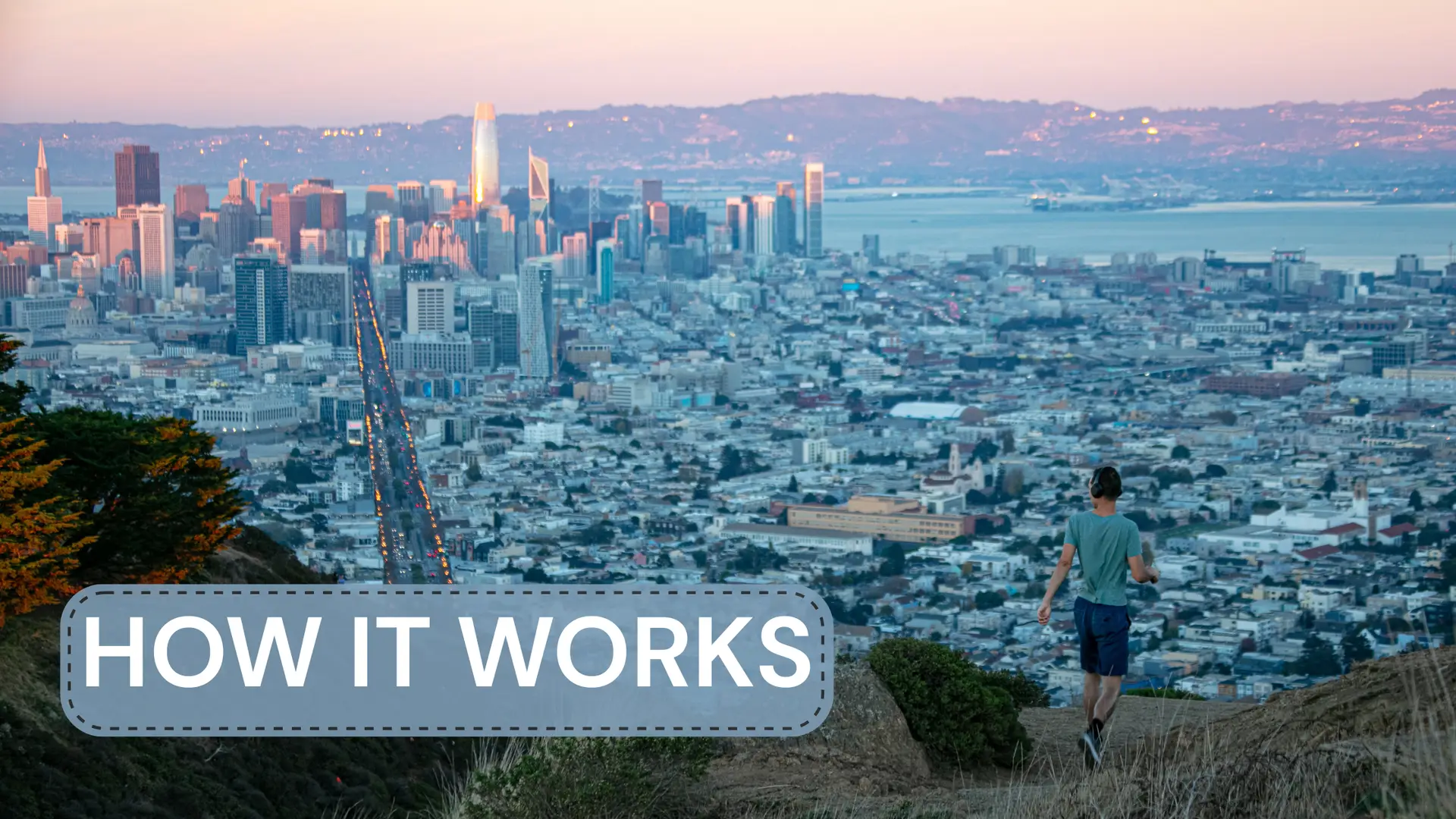Man embarking on a hike from the top of Twin Peaks in San Francisco, CA.